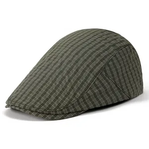 Detail van de vintage groene geruite stof en stiksels op de Britse platte pet