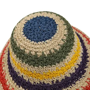Close-up of the rainbow handmade woven texture and colorful patterns on the straw hat