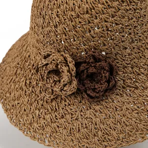 Summer foldable straw sun hat for women with large brim and handmade floral decor
