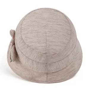 Summer sun hat for women with wide brim and floral ribbon bow in khaki cotton