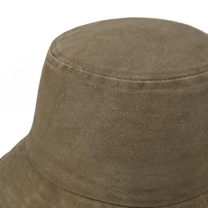 Detailed view of heavy-duty khaki twill cotton stitching on a vintage bucket hat brim