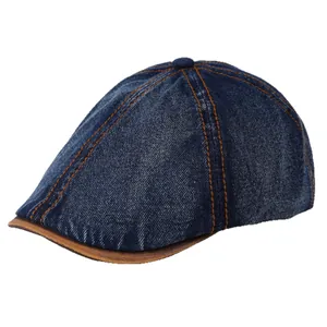 Vintage denim newsboy cap in navy blue with leather brim and contrast stitching