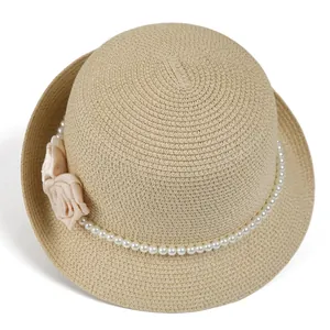 Elegant straw sun hat for women with pearl trim and pink fabric flower detail