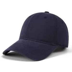 Detailed view of deep blue cotton twill baseball cap showing six-panel stitching and vent holes
