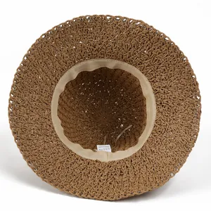 Women's foldable straw sun hat with large brim and interior sweatband detail