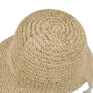 Close-up of woven straw hat crown showing detailed spiral crochet pattern and texture