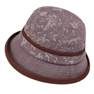 Elegant mauve sun hat for elderly women with floral patterns and brown ribbon trim
