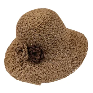 Women's dark coffee straw sun hat with large brim and decorative woven flowers