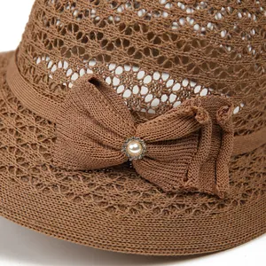 Brown woven sun hat for women with elegant bow and pearl rhinestone decoration