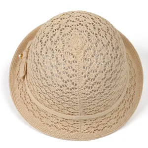 Elegant beige woven straw sun hat with ribbon bow and pearl detail for women