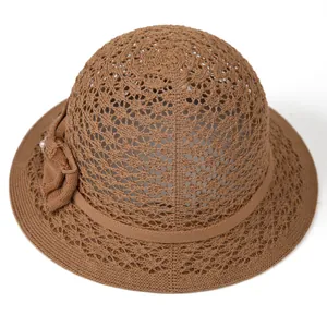 Brown knit sun hat for elderly women with hollow patterns and pearl bow detail