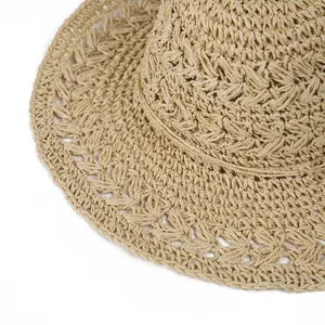 Detailed close-up of breathable woven texture on a khaki straw hat for sun protection