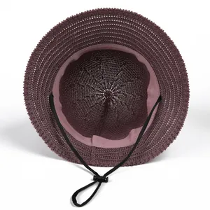 Interior view of women's woven sun hat featuring adjustable chin strap and breathable mesh