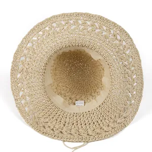 Women's hollow straw sun hat made of 100% paper material for beach vacation and sun protection