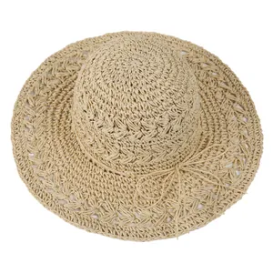 Hollow straw hat for women with wide brim and decorative bow for summer beach vacation