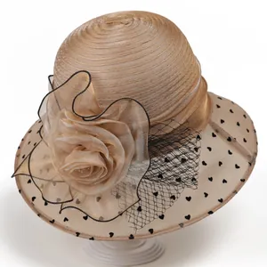 Detail of organza flower and black heart polka dot mesh on champagne sun hat