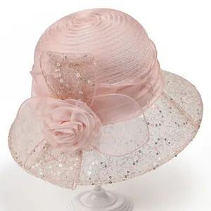 Close-up of pink organza sun hat featuring 3D mesh flowers and shimmering sequins detail