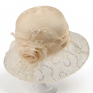 Close-up of elegant organza sun hat with large floral petal detail and sequin mesh trim
