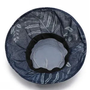Internal view of sun hat showing breathable mesh lining and floral pattern fabric