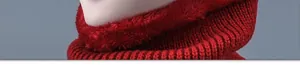 Close-up of winter knit neck warmer with thick red fleece lining for cold protection