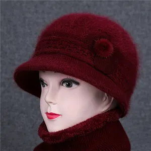 Winter knitted wine red bucket hat and neck warmer set for women with plush fur detail