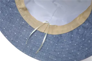 Close-up of breathable inner lining and adjustable drawstring on floral sun hat
