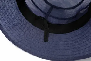 Detail view of breathable mesh texture and inner sweatband on women's sun hat