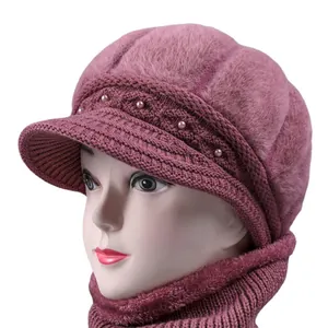 Winter women's knit hat and scarf set in dusty pink with pearl decor and cozy fur texture