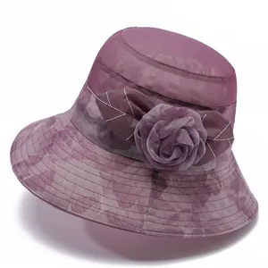 Close-up of elegant purple sun hat featuring handmade organza floral detail and mesh texture