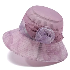 Elegant lavender sun hat for women featuring mesh fabric and floral decor on a white base