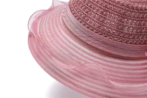 Detailed view of pink organza layers and woven texture on a women sun protection hat