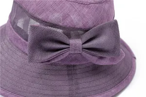 Detail of purple sun hat showing breathable mesh panels and mesh bow decoration