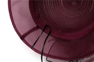 Macro view of the wine red organza sun hat interior showing fine stitching and texture