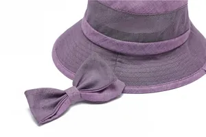 Detail of lavender sun hat showing breathable mesh texture and stylish bow decoration