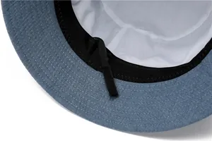 Detail view of the sun hat inner lining with adjustable strap and black sweatband