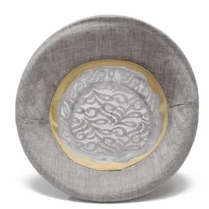 Detail view of the gray sun hat featuring breathable lace lining and yellow sweatband