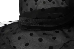 Macro view of breathable black polka dot organza mesh fabric detailing on the sun hat