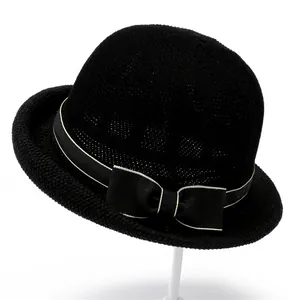Classic black straw sun hat for elderly women with decorative ribbon bow detail