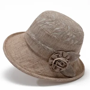 Detailed close-up of breathable fabric and floral lace on a wide brim sun hat