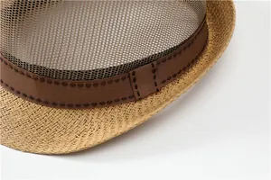 Detail of breathable mesh crown and woven band on a men's summer fedora straw hat