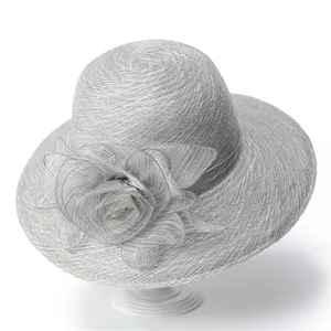 Detail of elegant grey organza sun hat with a large 3D floral decoration on the side