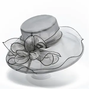 Detailed view of grey organza sun hat featuring large bow decoration and wide brim