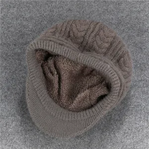 Close-up of coffee brown knit hat featuring thick cable weave and warm fleece lining