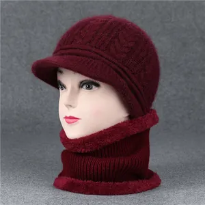 Detail of wine red winter knit hat and scarf set with thick warm faux rabbit fur lining