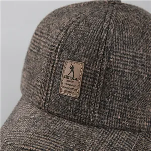 Winter men's brown plaid baseball cap with warm ear protection and thick wool fabric