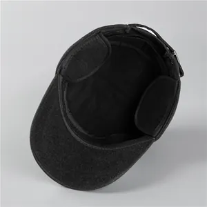 Detail of wool blend winter hat with folding ear flaps and soft fleece lining for warmth