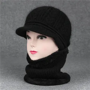 Close-up of black winter knitted hat and neck warmer set with warm fleece lining