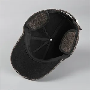 Detail view of winter flat cap with thick fleece lining and adjustable metal buckle strap