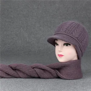 Detail of purple knitted wool hat and scarf set with chunky cable pattern