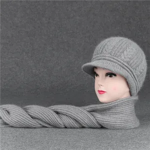 Detail of grey knitted hat and scarf set with cable knit pattern for older women